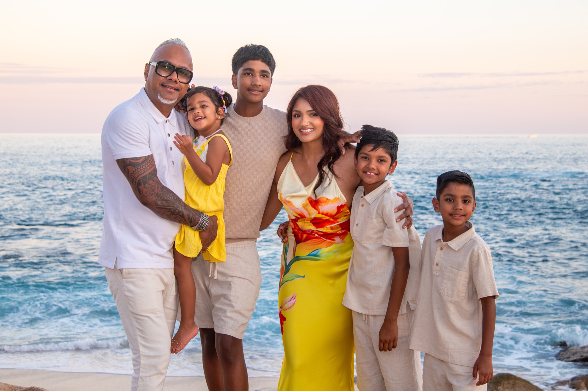 Nitesh Prakash with his family by the ocean